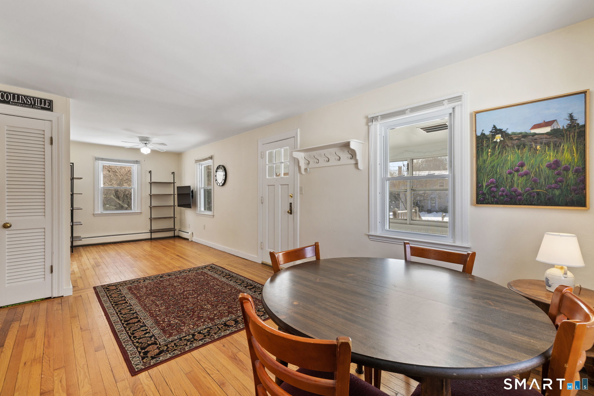 10 School Street Burlington, CT 06013 - Photo 15 of 35 a living room with furniture and wooden floor