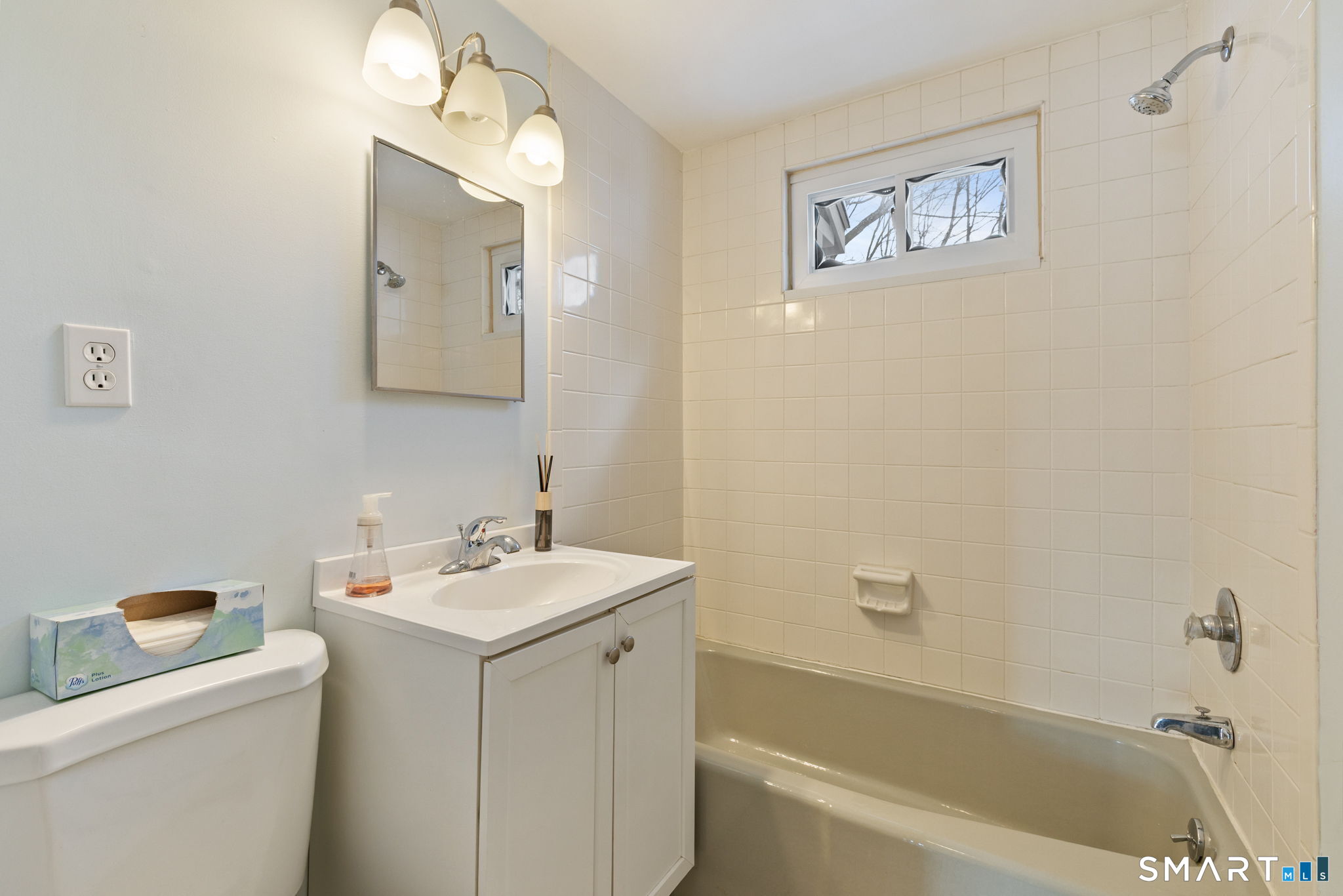 10 School Street Burlington, CT 06013 - Photo 16 of 35 a bathroom with a sink and a bathtub