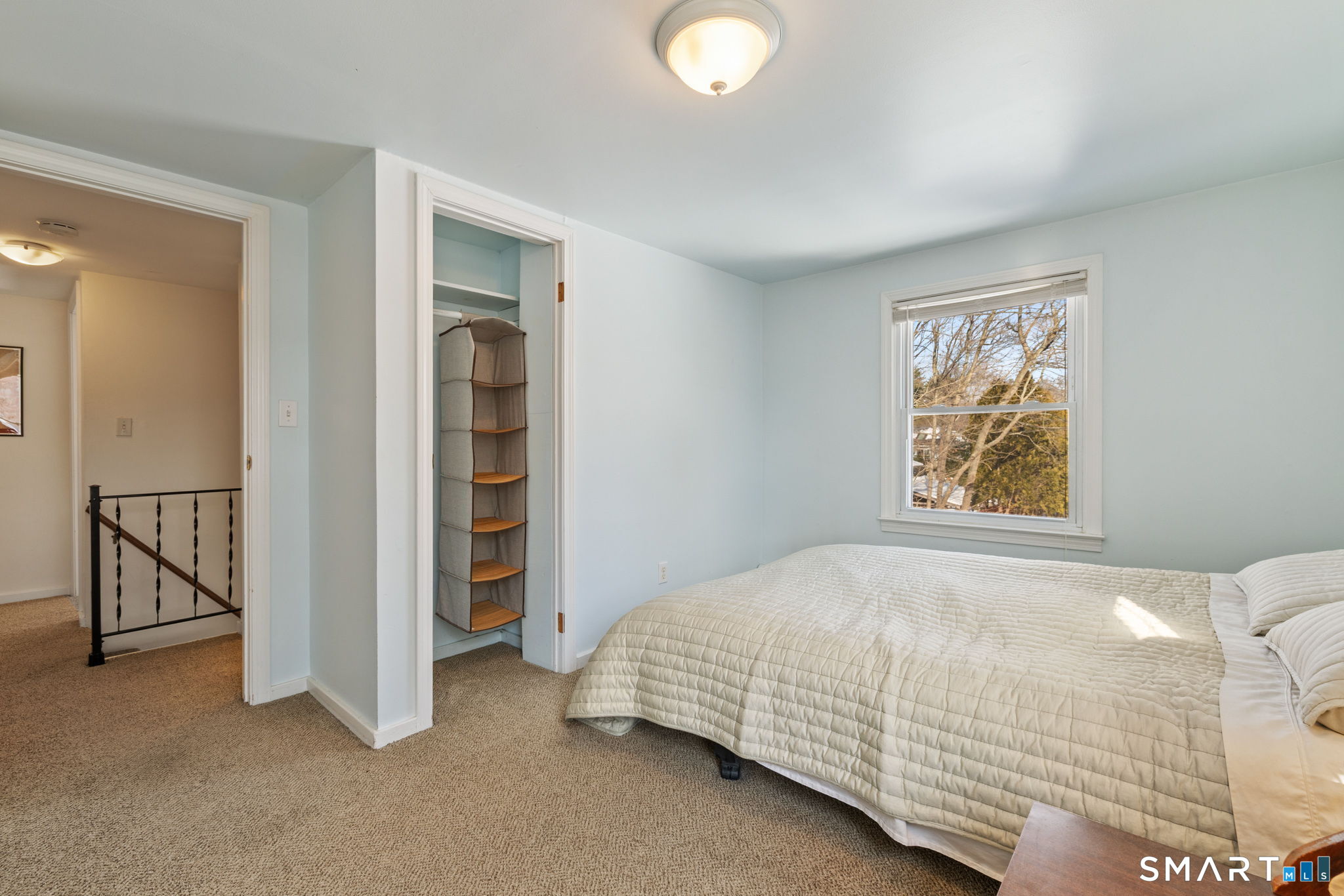 10 School Street Burlington, CT 06013 - Photo 21 of 35 a bedroom with a bed and a window