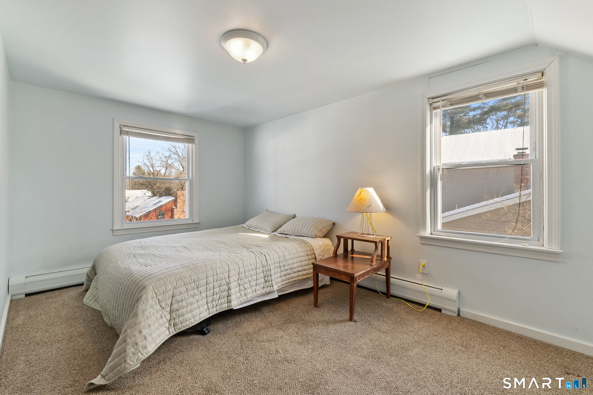 10 School Street Burlington, CT 06013 - Photo 22 of 35 a bedroom with a bed and a window