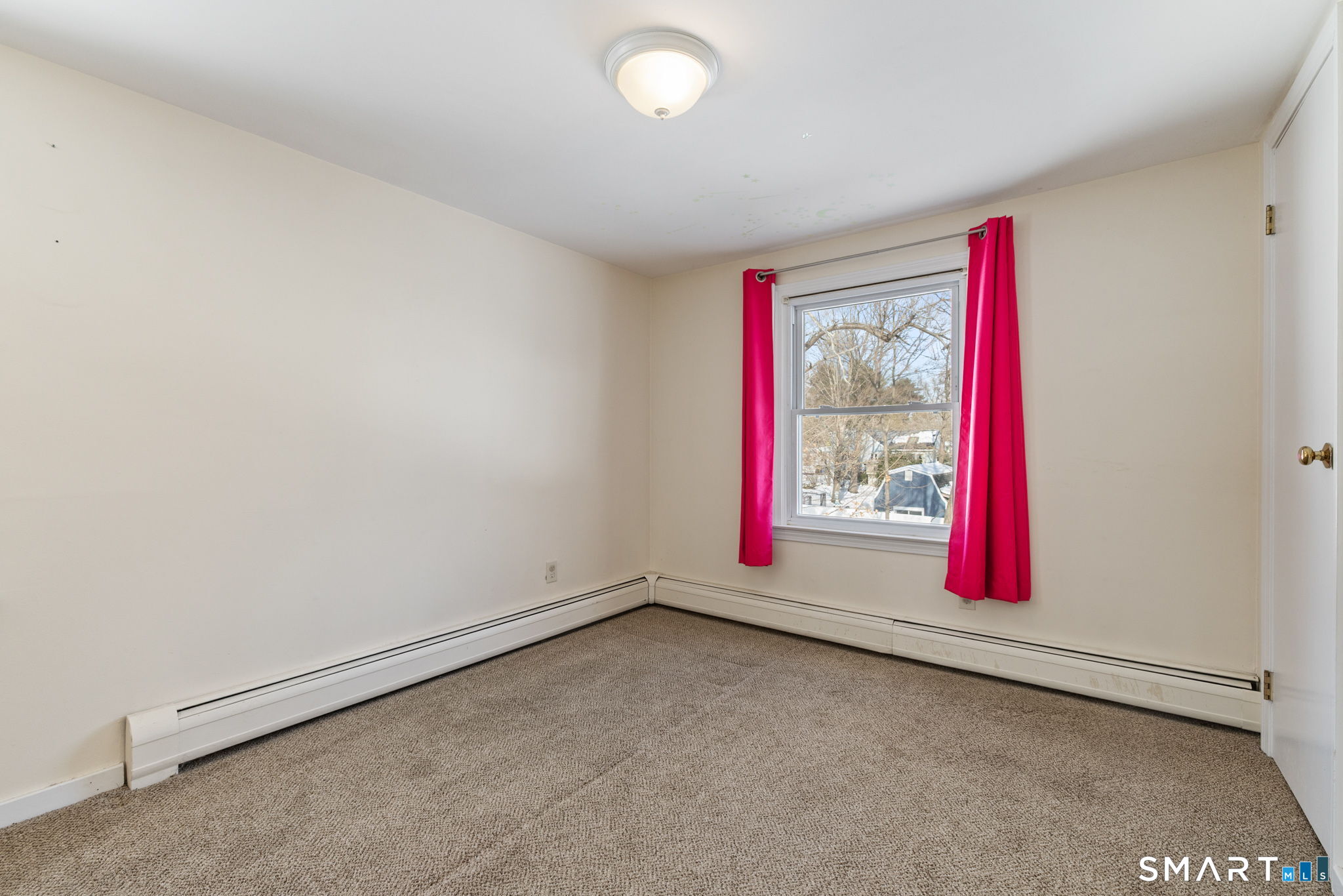 10 School Street Burlington, CT 06013 - Photo 24 of 35 an empty room with a projector and windows