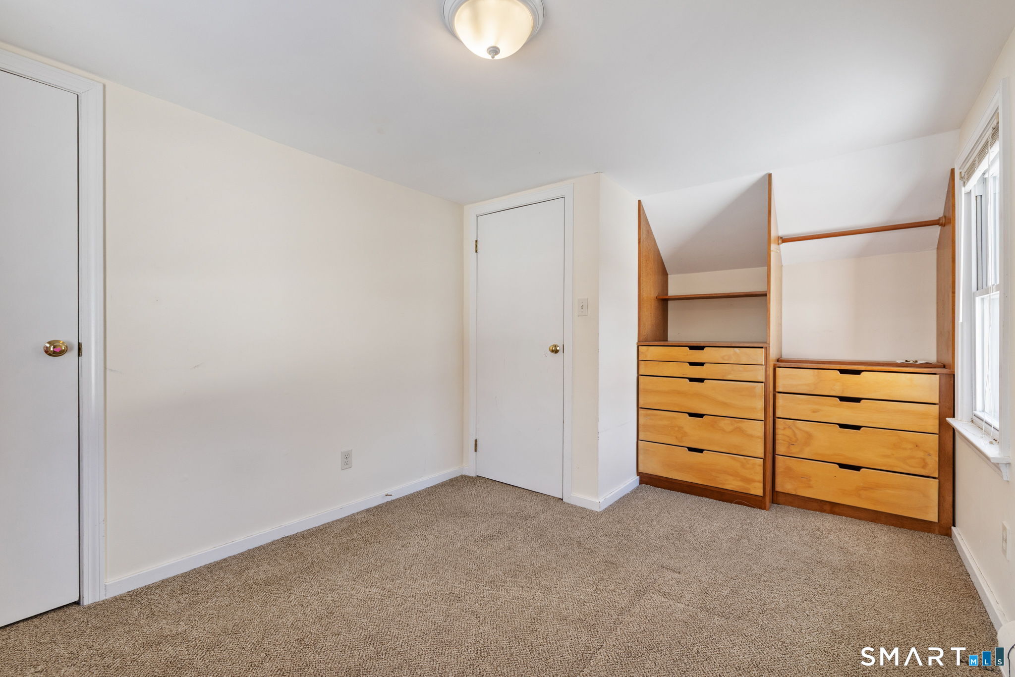 10 School Street Burlington, CT 06013 - Photo 26 of 35 a view of an empty room with cabinet and window