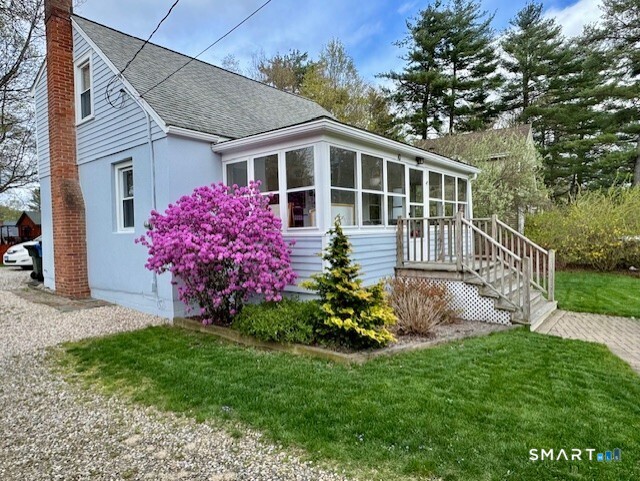 10 School Street Burlington, CT 06013 - Photo 34 of 35 a front view of a house with a garden