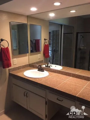 a bathroom with a sink and a mirror