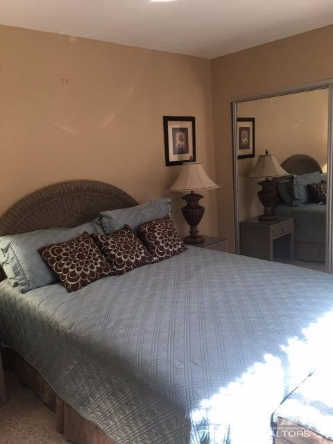 63 Torremolinos Drive Rancho Mirage, CA 92270 - Photo 12 of 32 a bed sitting in a bedroom and dressers