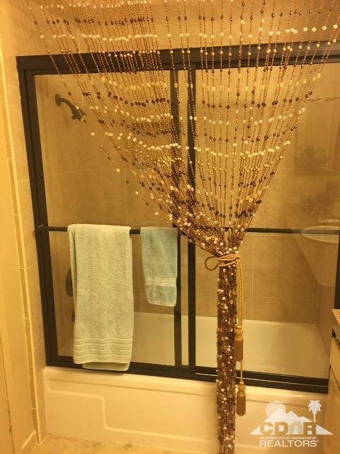 63 Torremolinos Drive Rancho Mirage, CA 92270 - Photo 15 of 32 a view of a bathroom with a small window