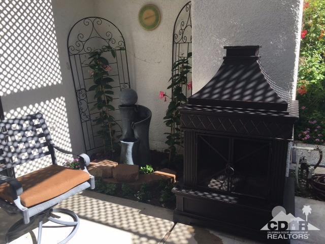 63 Torremolinos Drive Rancho Mirage, CA 92270 - Photo 17 of 32 a living room with furniture and a fireplace