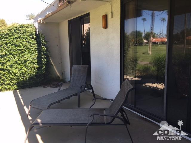 63 Torremolinos Drive Rancho Mirage, CA 92270 - Photo 18 of 32 a balcony with table and chairs