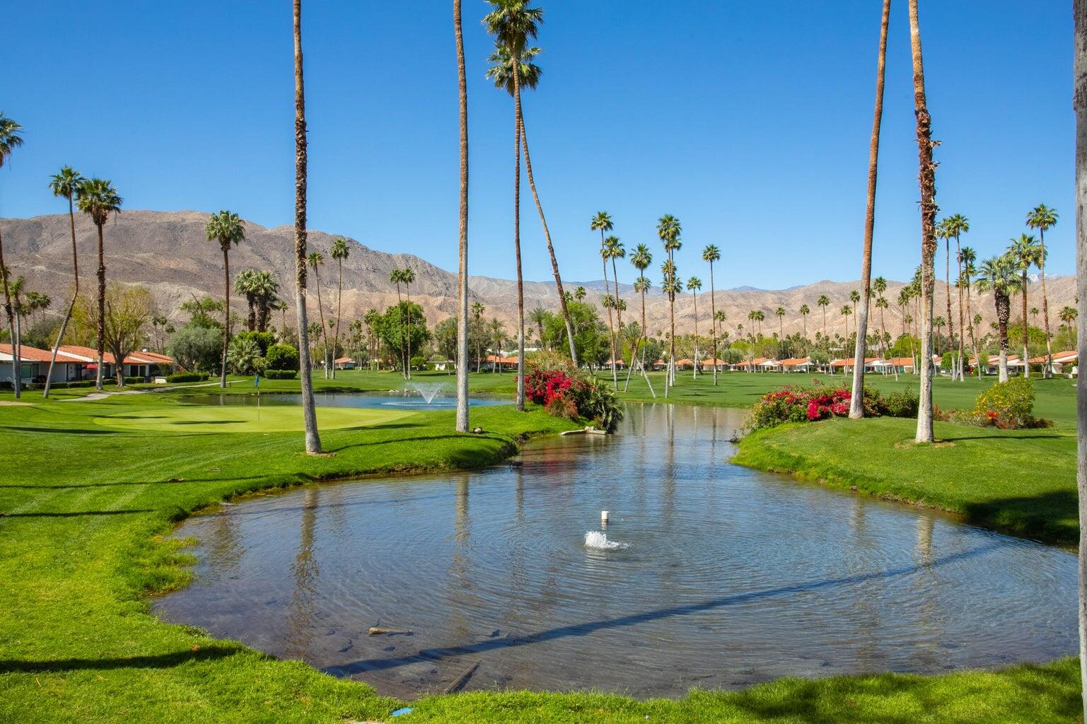 63 Torremolinos Drive Rancho Mirage, CA 92270 - Photo 25 of 32 a view of a park with large trees