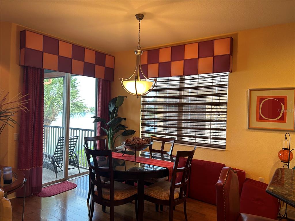 1139 Riverscape Street, Unit 1139 Bradenton, FL 34208 - Photo 13 of 45 a dining room with furniture and window