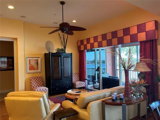 a living room with fireplace furniture and a flat screen tv