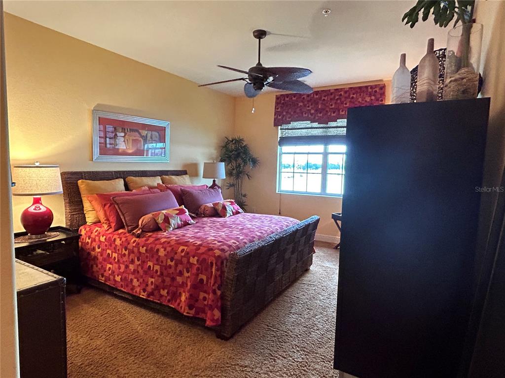 1139 Riverscape Street, Unit 1139 Bradenton, FL 34208 - Photo 18 of 45 a bedroom with bed and window