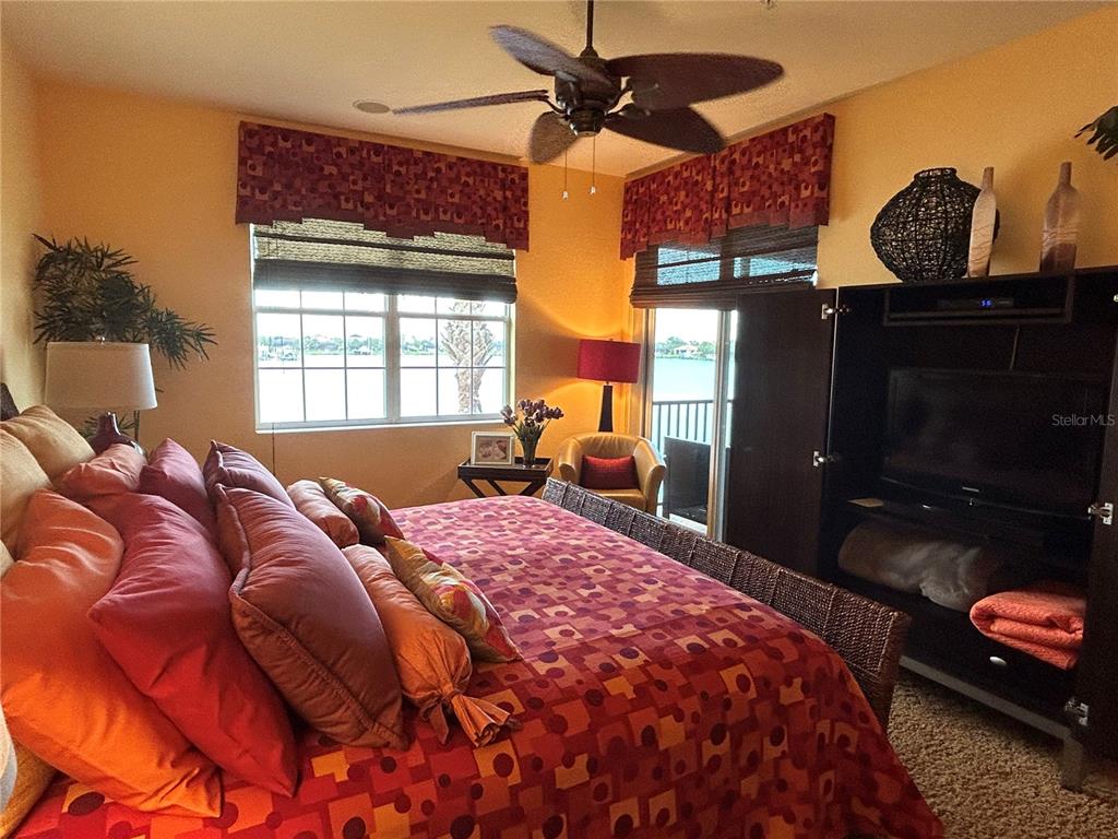 1139 Riverscape Street, Unit 1139 Bradenton, FL 34208 - Photo 20 of 45 a bed sitting in a bedroom next to a window