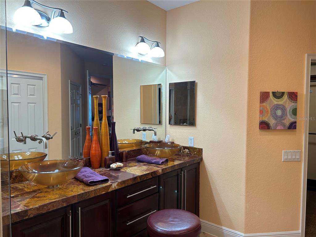 1139 Riverscape Street, Unit 1139 Bradenton, FL 34208 - Photo 28 of 45 a bathroom with a sink and a mirror