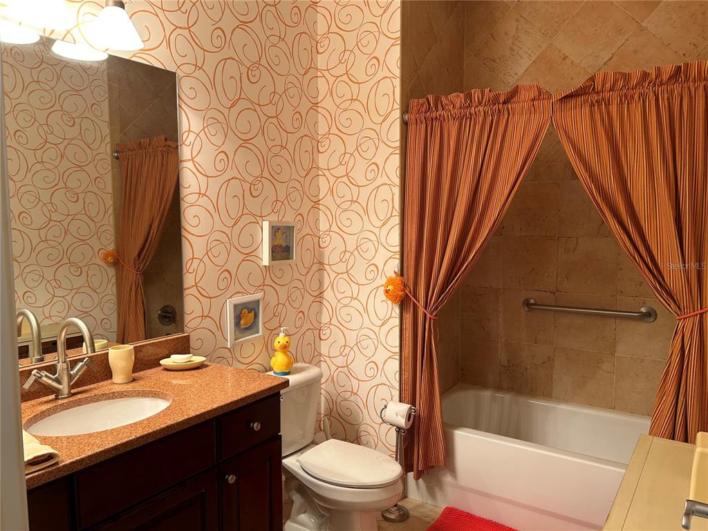 1139 Riverscape Street, Unit 1139 Bradenton, FL 34208 - Photo 29 of 45 a bathroom with a sink a toilet and shower