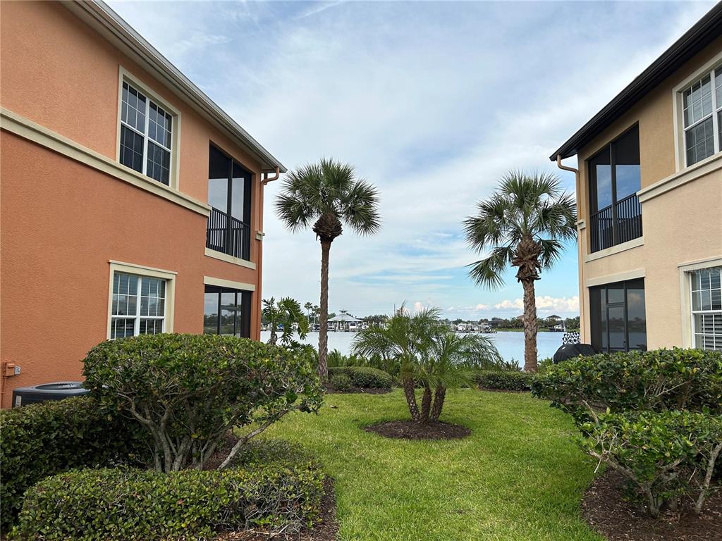 1139 Riverscape Street, Unit 1139 Bradenton, FL 34208 - Photo 3 of 45 a front view of a house with a garden