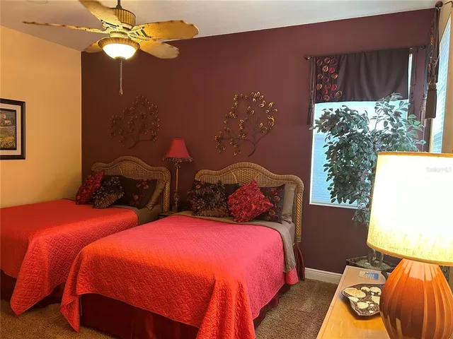 a bedroom with a bed and a television