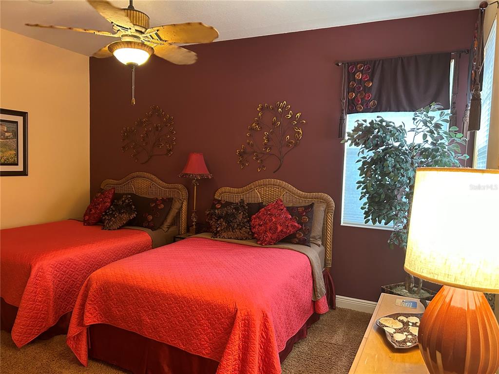 1139 Riverscape Street, Unit 1139 Bradenton, FL 34208 - Photo 31 of 45 a bedroom with two beds and a window