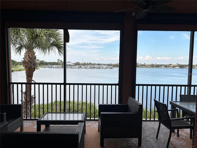 a view of a balcony with chairs