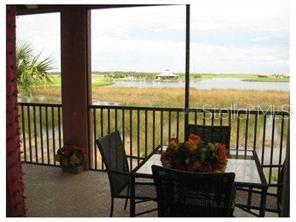 1139 Riverscape Street, Unit 1139 Bradenton, FL 34208 - Photo 35 of 45 a view of a balcony with lake and mountain view