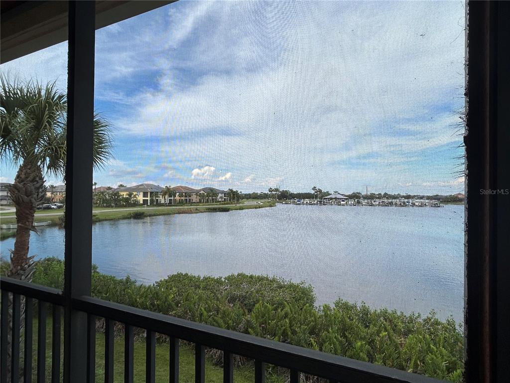 1139 Riverscape Street, Unit 1139 Bradenton, FL 34208 - Photo 37 of 45 a view of a lake from a balcony