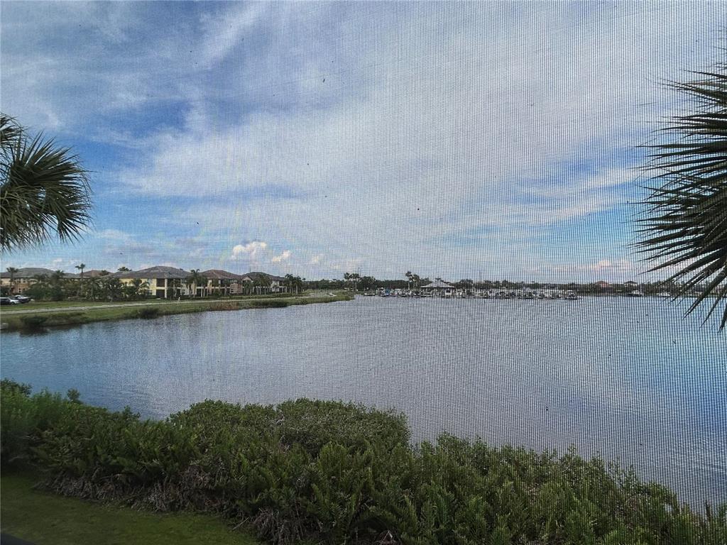 1139 Riverscape Street, Unit 1139 Bradenton, FL 34208 - Photo 38 of 45 a view of a lake from a yard