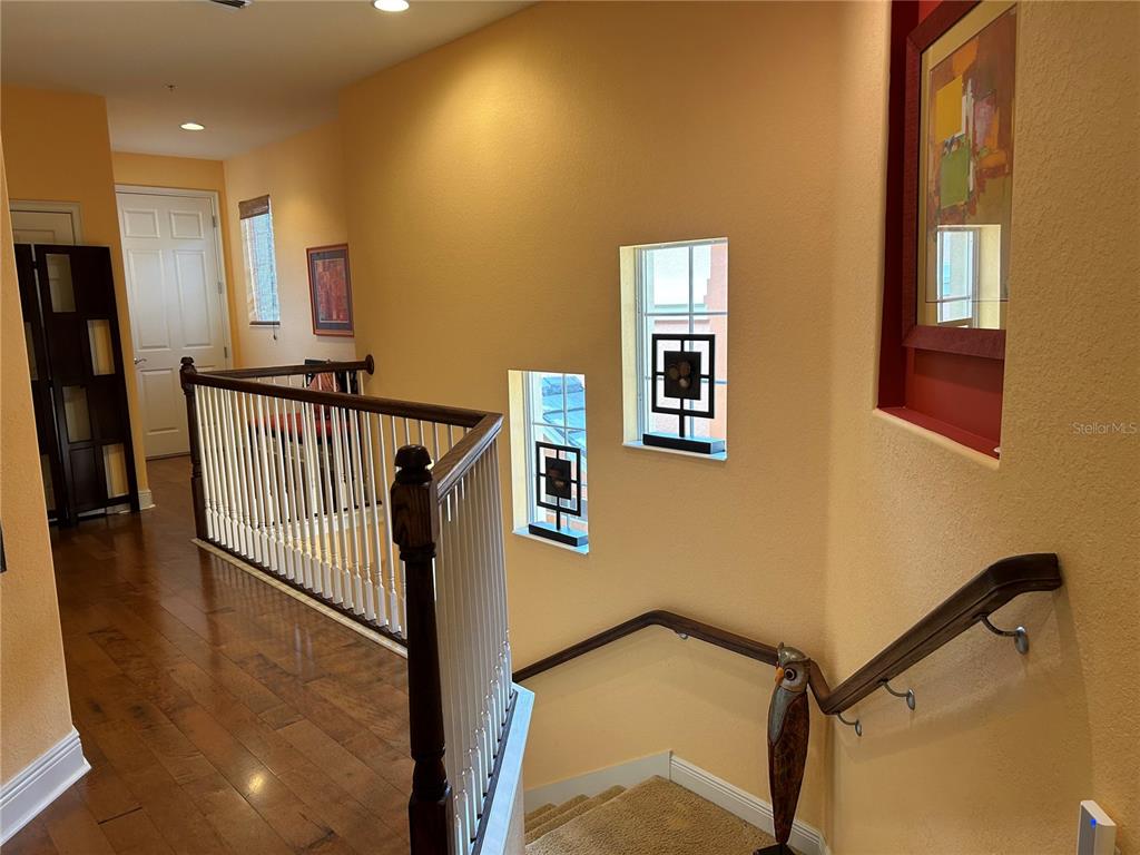 1139 Riverscape Street, Unit 1139 Bradenton, FL 34208 - Photo 4 of 45 a view of a hallway with windows