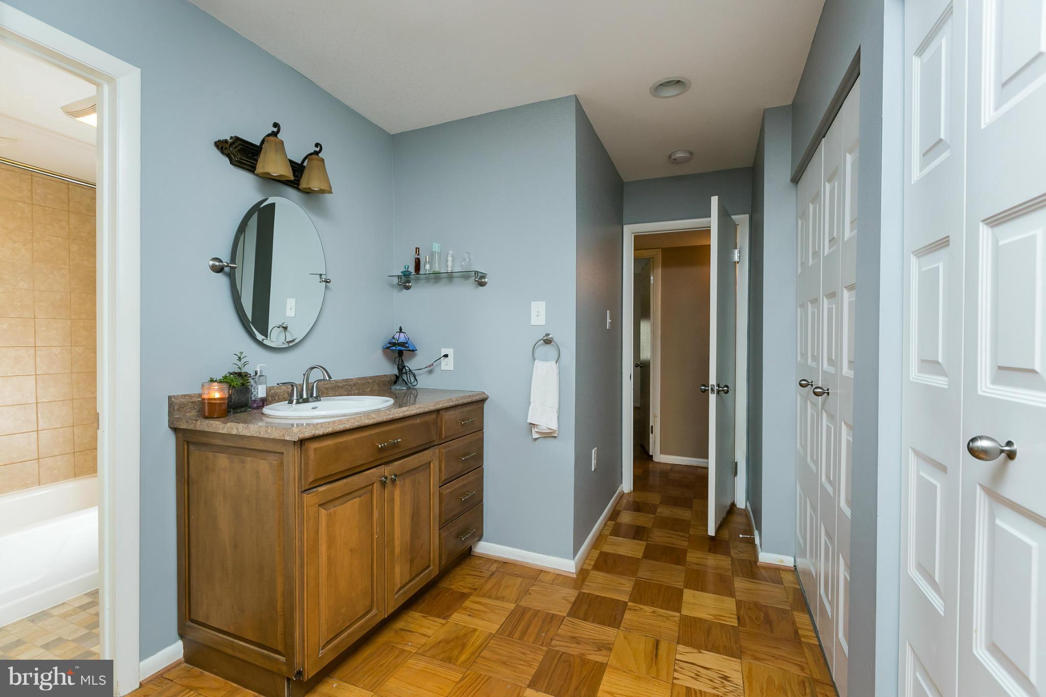 5235 West Running Brook Road, Unit 302 Columbia, MD 21044 - Photo 17 of 29 a bathroom with a sink and a mirror