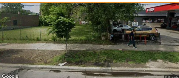 a view of a chairs and table in backyard