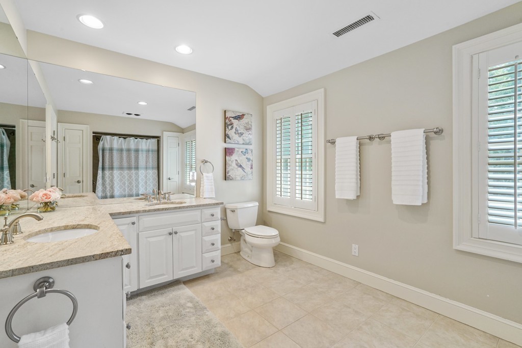 219 B Ipswich Road Boxford, MA 01921 - Photo 25 of 30 a bathroom with a granite countertop toilet sink and mirror