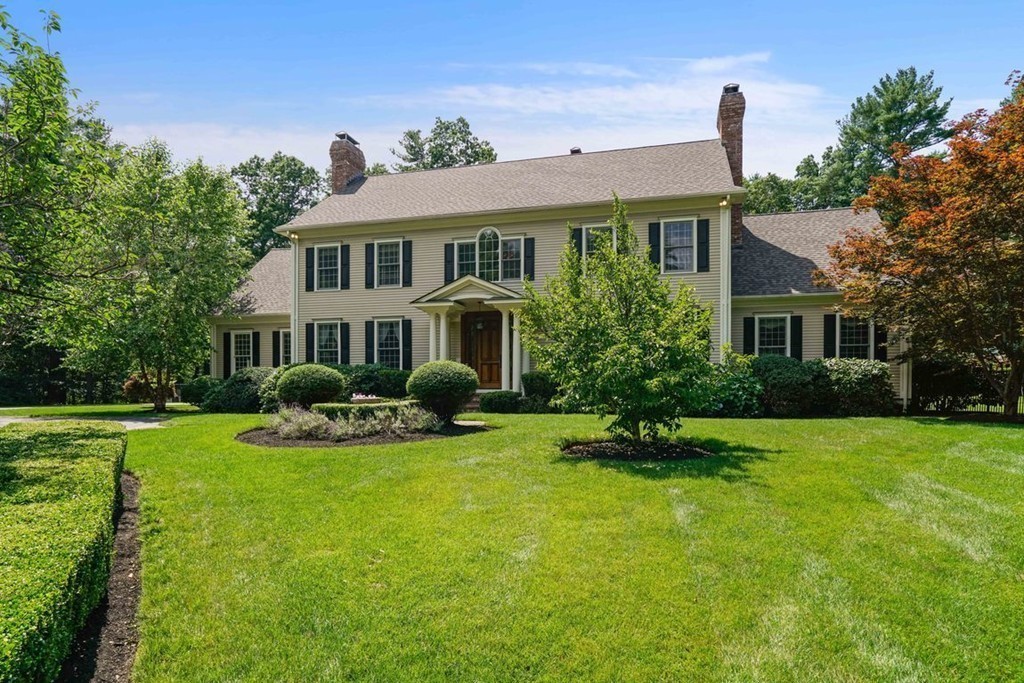 219 B Ipswich Road Boxford, MA 01921 - Photo 3 of 30 a front view of a house with a yard table and chairs
