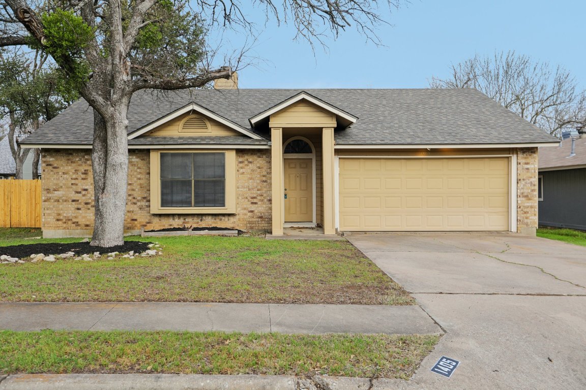 1405 Butternut Place Cedar Park, TX 78613 - Photo 1 of 1 a front view of a house with garden