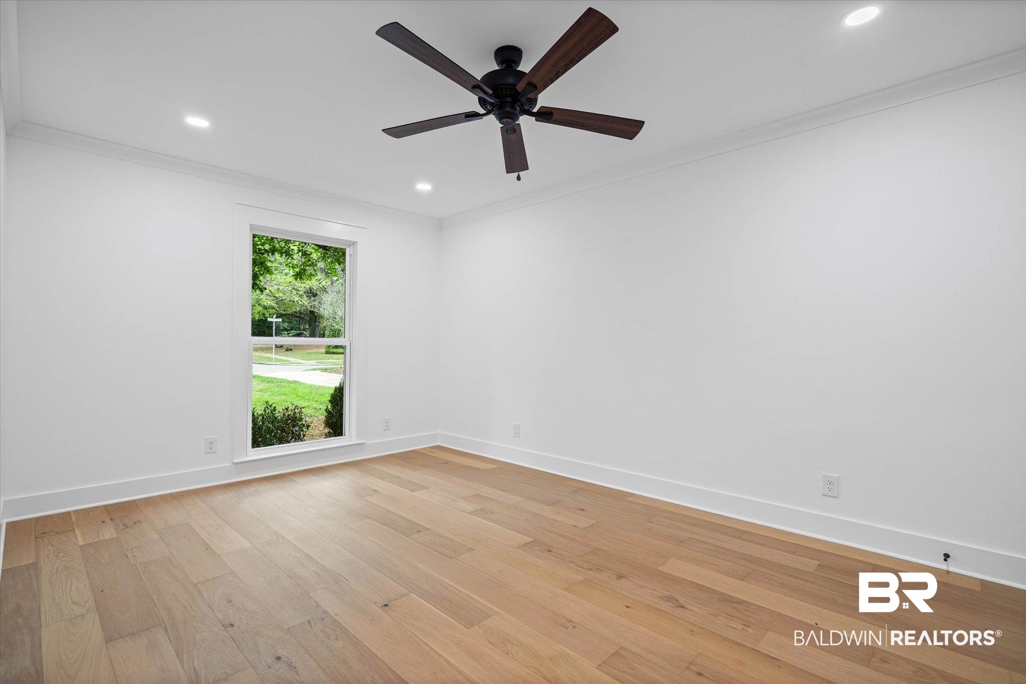 11 Schwaemmle Drive Mobile, AL 36608 - Photo 24 of 32 Empty room featuring ornamental molding, recessed lighting, light wood-type flooring, and a ceiling fan