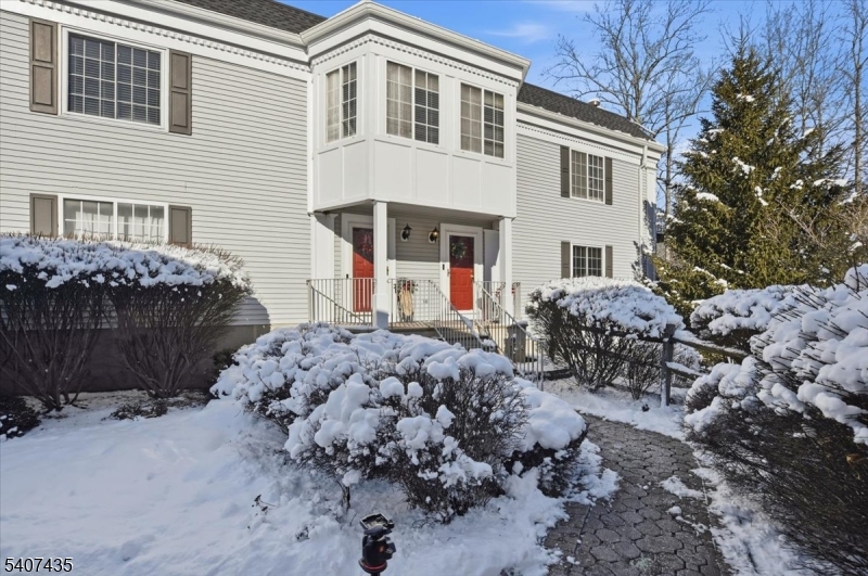 139 Riveredge Drive, Unit 139 Chatham, NJ 07928 - Photo 1 of 32 a front view of a house with a yard