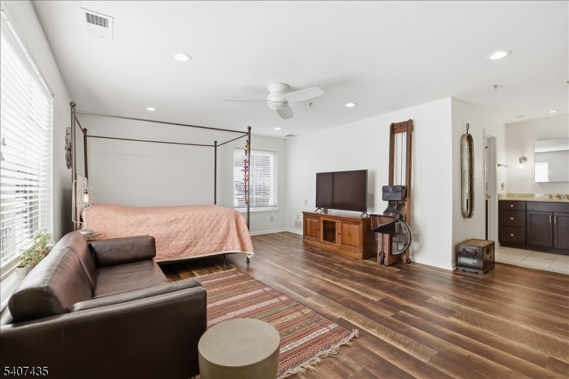 139 Riveredge Drive, Unit 139 Chatham, NJ 07928 - Photo 15 of 32 a living room with furniture and a flat screen tv