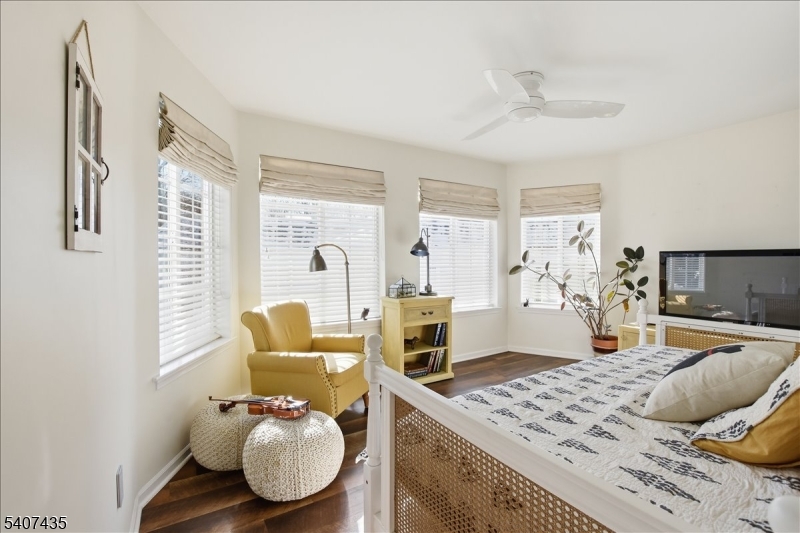 139 Riveredge Drive, Unit 139 Chatham, NJ 07928 - Photo 20 of 32 a living room with furniture and wooden floor