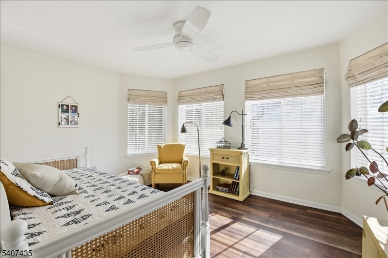 139 Riveredge Drive, Unit 139 Chatham, NJ 07928 - Photo 21 of 32 a bedroom with furniture and windows