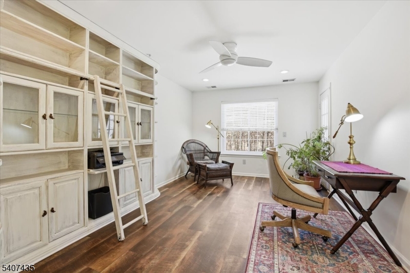 139 Riveredge Drive, Unit 139 Chatham, NJ 07928 - Photo 22 of 32 a workspace with furniture window and wooden floor