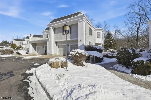 a view of a house with sitting area and garden