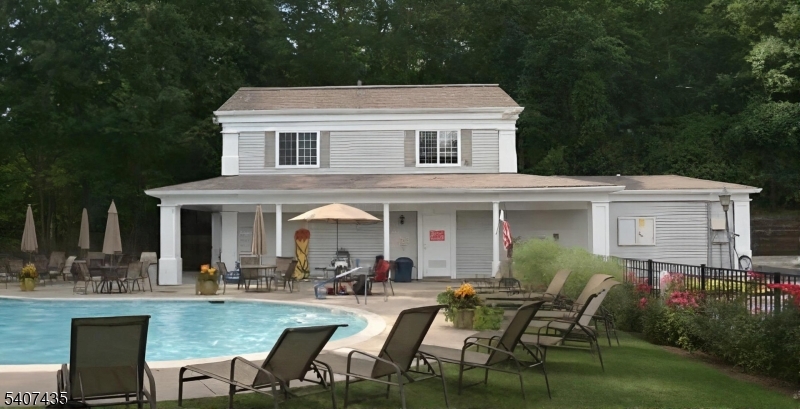 139 Riveredge Drive, Unit 139 Chatham, NJ 07928 - Photo 29 of 32 a view of a house with sitting area and garden