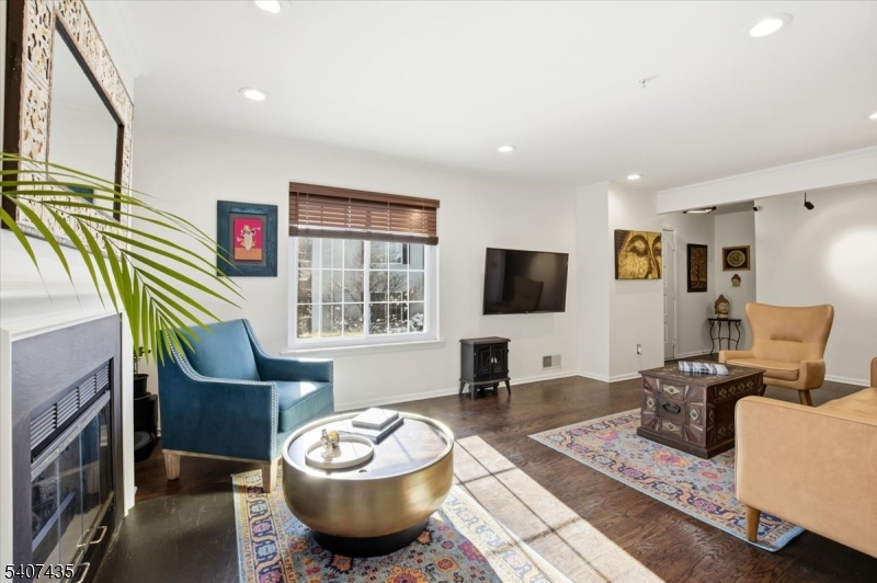 139 Riveredge Drive, Unit 139 Chatham, NJ 07928 - Photo 4 of 32 a living room with furniture and a flat screen tv