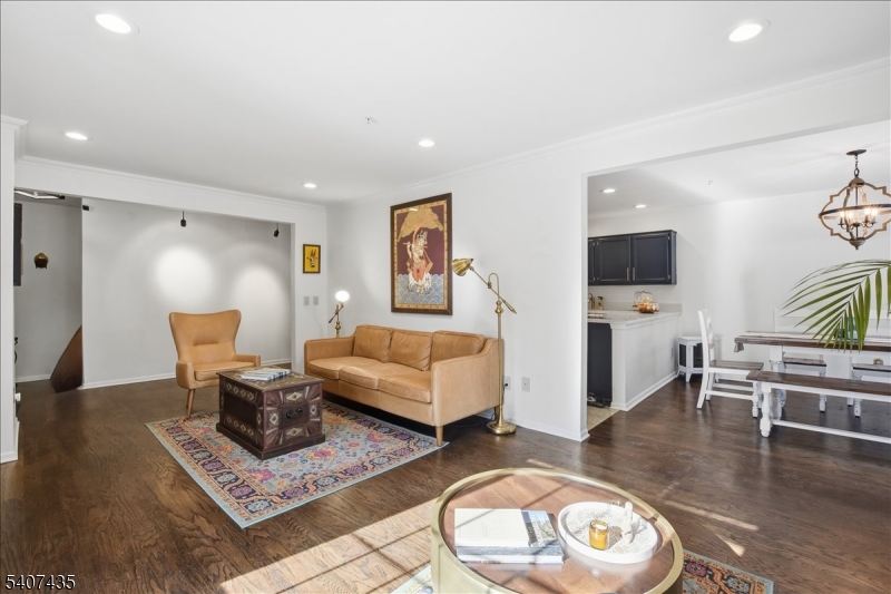 139 Riveredge Drive, Unit 139 Chatham, NJ 07928 - Photo 5 of 32 a living room with furniture and a flat screen tv