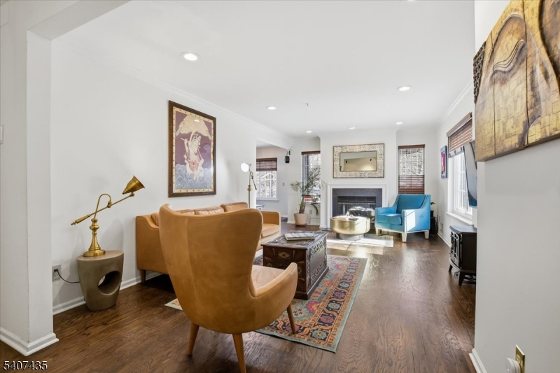 139 Riveredge Drive, Unit 139 Chatham, NJ 07928 - Photo 6 of 32 a living room with furniture and a fireplace