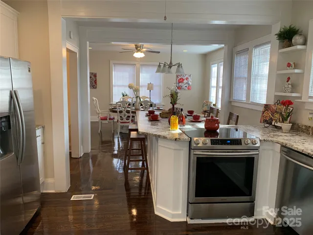 a kitchen with a sink stove and refrigerator