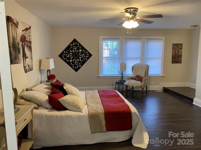 a bathroom with a glass door shower and a sink