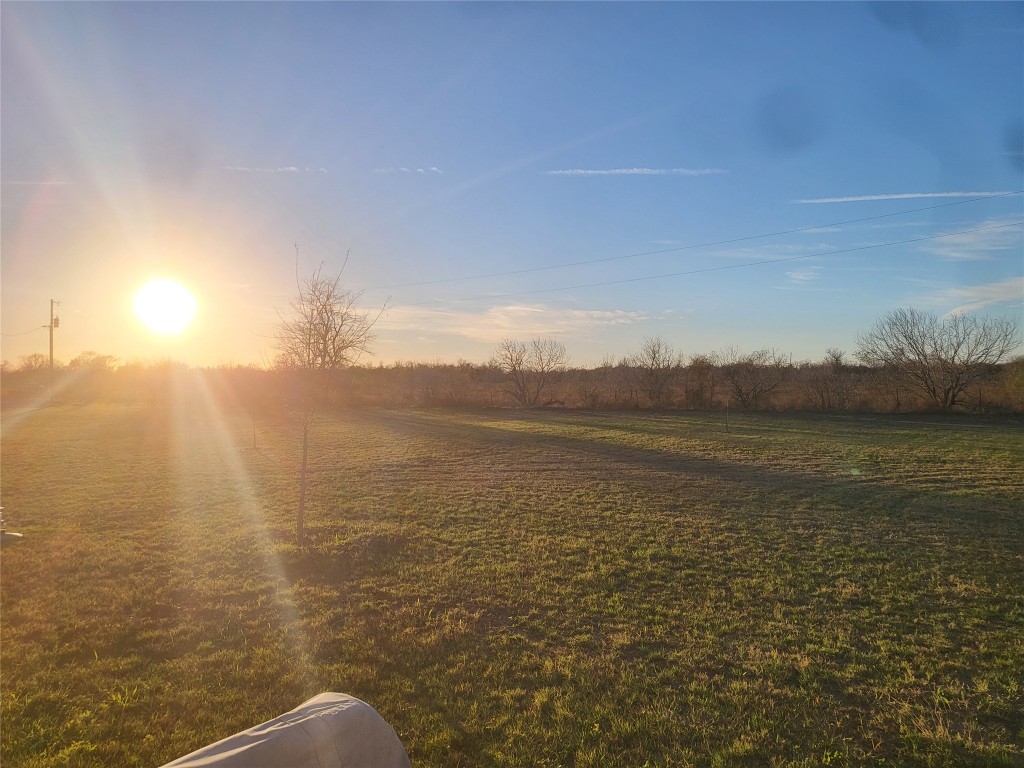 View of yard with a rural view