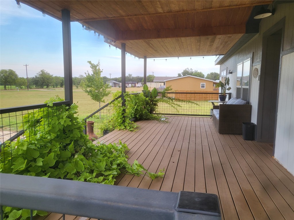 192 Lazy River Lane Elgin, TX 78621 - Photo 2 of 12 Porch featuring a lawn