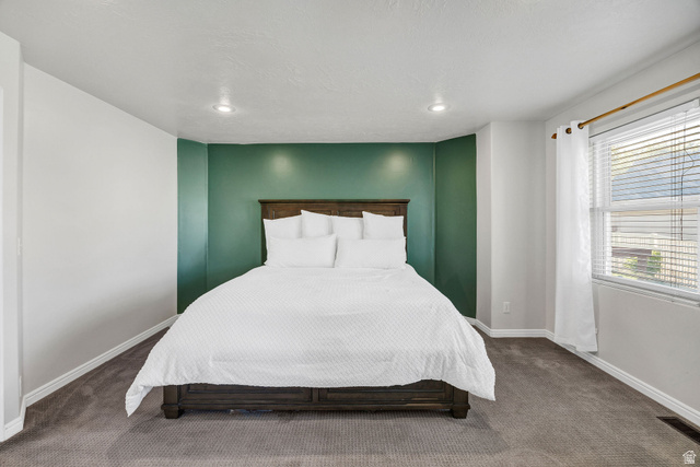 892 East 400 South Smithfield, UT 84335 - Photo 19 of 44 Primary Bedroom with carpet floors and recessed lighting