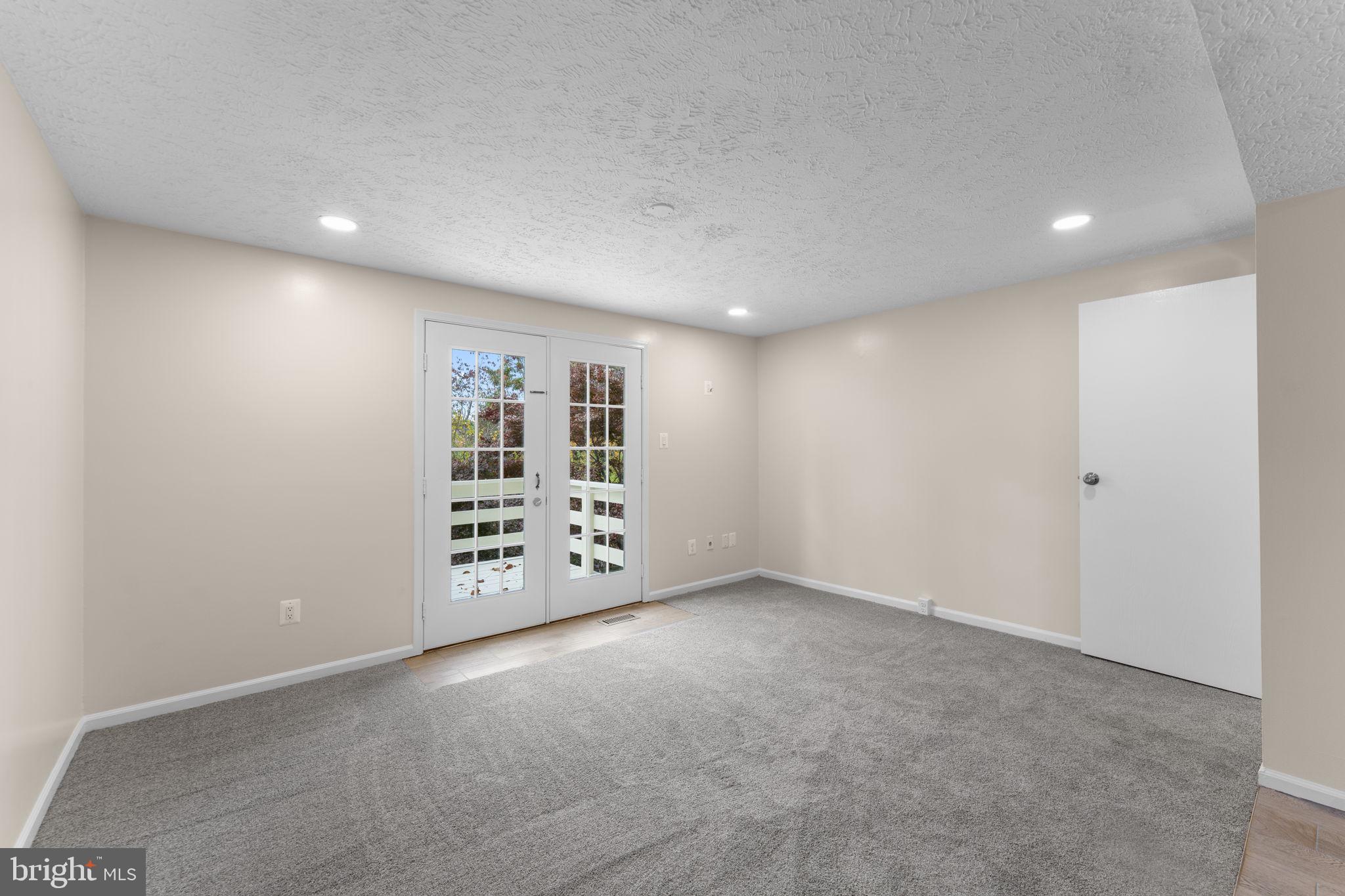 1644 Fieldthorn Drive Reston, VA 20194 - Photo 12 of 43 a view of an empty room with a window and stairs