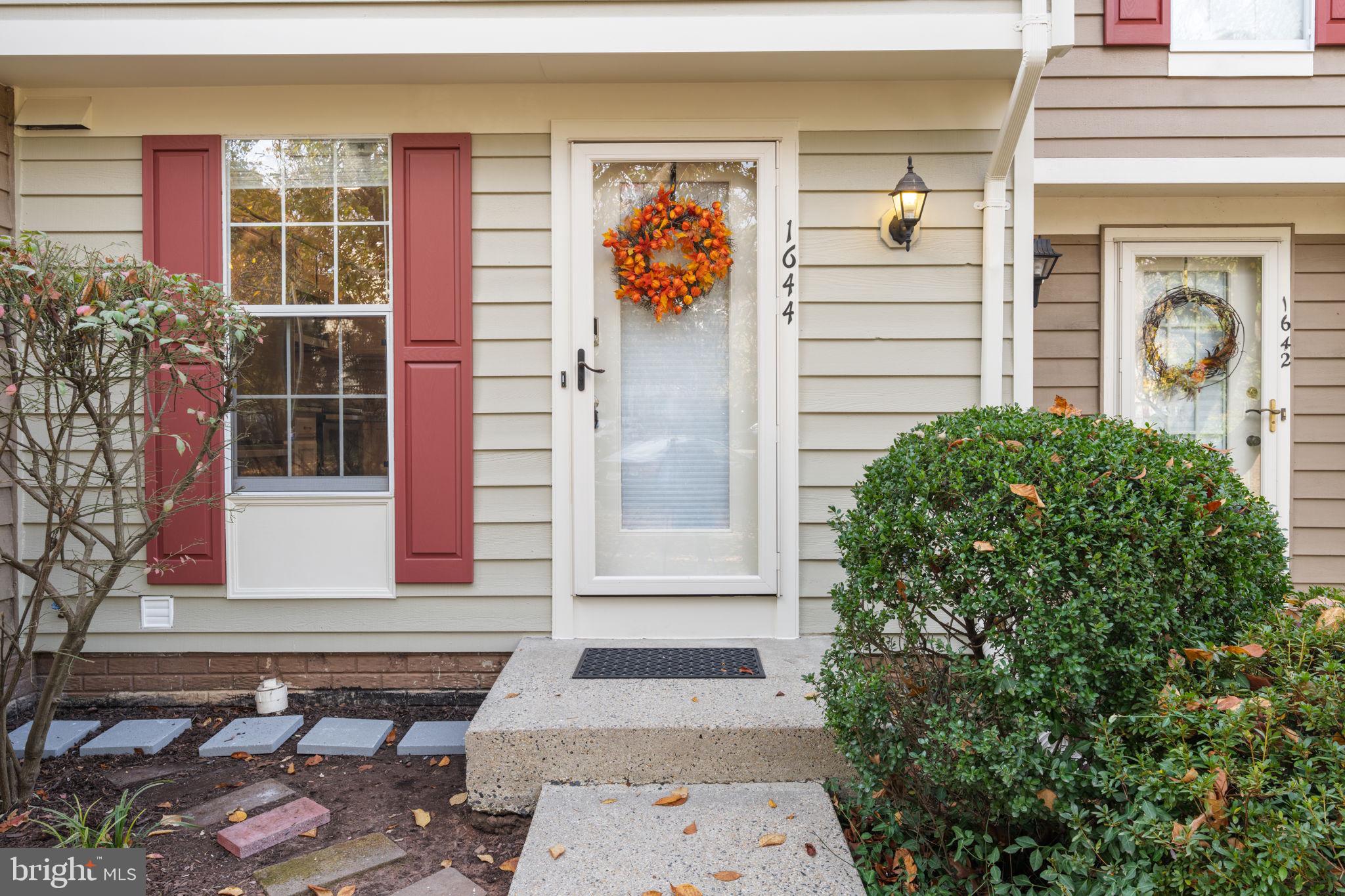 1644 Fieldthorn Drive Reston, VA 20194 - Photo 2 of 43 a front view of a house with a garage